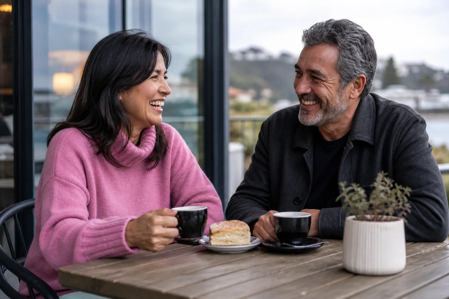 Mature couple enjoying a relaxed conversation beside the Dorset coast